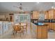 A bright breakfast nook is adjacent to this eat-in kitchen featuring ample cabinet and counter space at 8116 W Fremont Dr, Littleton, CO 80128