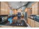 A beautifully designed kitchen featuring granite countertops, stainless steel appliances, and abundant cabinet storage at 8116 W Fremont Dr, Littleton, CO 80128