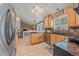 Bright eat-in kitchen featuring granite counters, stainless steel appliances, and a lovely pendant lighting fixture at 8116 W Fremont Dr, Littleton, CO 80128