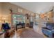 Spacious living room with hardwood floors, vaulted ceilings, a backyard view, and comfortable seating at 8116 W Fremont Dr, Littleton, CO 80128