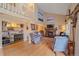 Bright living room with hardwood floors, vaulted ceilings, a cozy fireplace, and built-in bookshelves at 8116 W Fremont Dr, Littleton, CO 80128