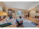 Inviting living room with large bay window, hardwood floors, and ample natural light at 8116 W Fremont Dr, Littleton, CO 80128