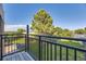 Cozy balcony offers a relaxing outdoor space with a view of lush greenery and clear blue skies at 5995 W Hampden Ave # 17F, Denver, CO 80227