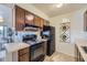 Efficient kitchen with essential appliances, ample cabinet space, and a seamless connection to the adjacent dining area at 5995 W Hampden Ave # 17F, Denver, CO 80227