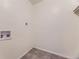 Unfinished utility room featuring connection points and outlets for installation of a washing machine and dryer at 5995 W Hampden Ave # 17F, Denver, CO 80227