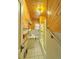 Cozy bathroom with wood paneled walls, tile flooring and shower-tub combo at 267 S 3Rd Ave, Brighton, CO 80601