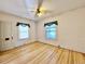 Spacious bedroom with hardwood floors and two windows at 267 S 3Rd Ave, Brighton, CO 80601