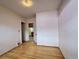 A bright, empty bedroom with hardwood floors and simple, clean walls at 267 S 3Rd Ave, Brighton, CO 80601