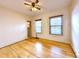 Bright bedroom featuring hardwood floors and two windows at 267 S 3Rd Ave, Brighton, CO 80601