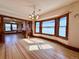 Charming dining room with hardwood floors and large windows offering ample natural light at 267 S 3Rd Ave, Brighton, CO 80601