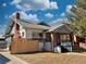 Charming exterior showcasing the home's architectural details, front porch, and well-maintained yard at 267 S 3Rd Ave, Brighton, CO 80601