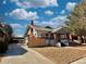 Exterior view of the residence, showing the front yard, driveway and covered parking at 267 S 3Rd Ave, Brighton, CO 80601