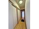 Hallway featuring hardwood floors and a pair of coat closets at 267 S 3Rd Ave, Brighton, CO 80601