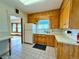 Traditional kitchen showing wood cabinets and a glimpse into the dining area at 267 S 3Rd Ave, Brighton, CO 80601