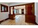 View of the living room showcasing hardwood floors and detailed wood trim at 267 S 3Rd Ave, Brighton, CO 80601