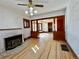 Bright living room featuring a fireplace, wood floors, and wood trim details at 267 S 3Rd Ave, Brighton, CO 80601