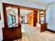 Sunlit living room emphasizing the beautiful hardwood floors and built-in wood features at 267 S 3Rd Ave, Brighton, CO 80601