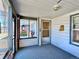 Enclosed front porch with windows and room for seating at 267 S 3Rd Ave, Brighton, CO 80601
