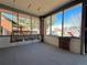 Relax on this charming enclosed porch with a swing, perfect for enjoying the outdoors at 267 S 3Rd Ave, Brighton, CO 80601
