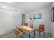 Cozy bedroom features a modern desk, stylish chairs, and a minimalist aesthetic at 1250 S Monaco Pkwy # 50, Denver, CO 80224