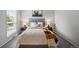 Bedroom with carpet, a queen bed, lamps and a horse artwork at 1250 S Monaco Pkwy # 50, Denver, CO 80224