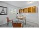 Bedroom with modern desk, chairs, and a large window to let natural light illuminate the space at 1250 S Monaco Pkwy # 50, Denver, CO 80224