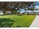 Well-maintained common green space with lush grass, landscaping, and a sidewalk at 1250 S Monaco Pkwy # 50, Denver, CO 80224