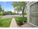 Exterior view of home with a walkway leading to the door, showcasing the community pool and pergola at 1250 S Monaco Pkwy # 50, Denver, CO 80224