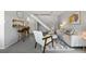 Open concept living room with an adjacent bar, stairs, and modern decor at 1250 S Monaco Pkwy # 50, Denver, CO 80224