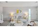 Bright living room featuring neutral tones, stylish decor, and natural light from the nearby entry door at 1250 S Monaco Pkwy # 50, Denver, CO 80224