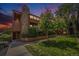 Charming multi-level condo with beautiful landscaping, a stone chimney, and outdoor access on the front at 4681 S Decatur St # 327, Englewood, CO 80110