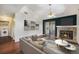 Inviting living room featuring a fireplace, hardwood floors, neutral walls, and sliding glass doors to the outside at 4681 S Decatur St # 327, Englewood, CO 80110