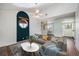 A comfortable living room area with vaulted ceilings, neutral walls, modern decor, and convenient access to other rooms at 4681 S Decatur St # 327, Englewood, CO 80110