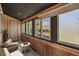 Relaxing porch with wicker furniture and scenic views through the windows, perfect for enjoying the outdoors at 4681 S Decatur St # 327, Englewood, CO 80110