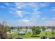 Community view of a beautiful blue sky with a lake, gazebo, picnic tables and green space for residents at 4681 S Decatur St # 327, Englewood, CO 80110