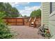 Outdoor area with a wooden deck, gravel ground cover, and a privacy fence offering a private retreat at 2427 Cherry Cir, Brighton, CO 80601