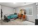 Bedroom featuring a bed, vanity, and window letting in natural light at 2427 Cherry Cir, Brighton, CO 80601