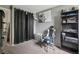 A bedroom with a computer chair, lion poster, storage cabinet, and ample floorspace at 2427 Cherry Cir, Brighton, CO 80601