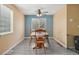 Inviting dining area with modern lighting, lots of natural light, and open floor plan at 2427 Cherry Cir, Brighton, CO 80601