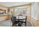 Bright dining area features a bay window and wood-look flooring at 2427 Cherry Cir, Brighton, CO 80601