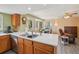 Bright and airy kitchen with ample counter space, wood cabinets, stainless steel appliances, and an open layout at 2427 Cherry Cir, Brighton, CO 80601