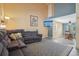 Open-concept living room boasts tall ceilings and flows into dining area at 2427 Cherry Cir, Brighton, CO 80601