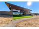 Exterior of the clubhouse with modern design, stone accents, and expansive glass windows at 4334 Ridgewalk Pt, Castle Rock, CO 80108