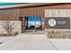 Entrance to The Spoke at Macanta with modern architecture and natural landscaping at 4334 Ridgewalk Pt, Castle Rock, CO 80108