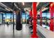 Bright gym with a heavy bag and workout equipment facing large windows overlooking the landscape at 4334 Ridgewalk Pt, Castle Rock, CO 80108