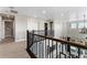 Open hallway with elegant railing overlooking the living area, showcasing modern design elements at 4334 Ridgewalk Pt, Castle Rock, CO 80108