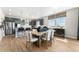 Eat-in kitchen and dining area with stainless steel appliances and abundant natural light at 4334 Ridgewalk Pt, Castle Rock, CO 80108
