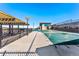 Community pool with covered seating and clubhouse in the background at 4334 Ridgewalk Pt, Castle Rock, CO 80108
