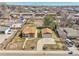 Aerial view of a home featuring a detached garage and a neatly manicured lawn at 7120 Utica St, Westminster, CO 80030