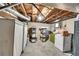 Unfinished basement offering ample storage space and visible ceiling pipes at 7120 Utica St, Westminster, CO 80030